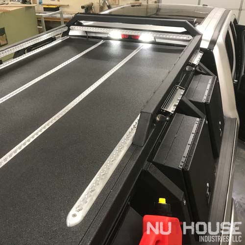 Nuthouse Industries, Nuthouse Industries rack, Nuthouse, Hard deck, aluminum truck bed cover, Dry truck storage, secure truck bed, truck bed shelf, coiling cover, coiling truck cover, aluminum coiling cover, retracting coil cover, Removable panel hard deck, truck bed with removable cover, load bearing truck cover, aluminum truck cover, locking truck cover, secure truck bed cover, strongest truck bed cover, aluminum truck rack, aluminum bed rack, aluminum expedition truck rack, overland rack, overland truck rack, expedition truck bed rack, overland gear, roof top tent rack, RTT rack, custom truck rack, overland, overland pickup, overland pickup truck, offroad pickup, pickup truck rack, overlanding full size truck, car camping, truck camping, ladder rack, removable cross bar, tacoma truck rack, truck bed rack, expedition truck, rotopax, best overland rack, Nissan Titan, Nissan Titan overland, titan power, eezi-awn, eezi-awn roof top tent, truck vault, overland storage, action packer for car camping, overland vehicles, Nuthouse rack, Nuthouse industries, nutzo rack, AEV RAM rack, RAM truck rack, RAM 2500, RAM 1500, ford super duty rack, ford raptor, ford f150, gm rack, chevy rack, toyota overland rack, tacoma overland, expedition rack, expedition truck, off road truck rack, offroad truck rack, off road truck bed rack, mid size truck rack, mid size overland, off road rack, rotopax, 23 zero, vision x, vision x dura mini, bundaberg roof top tent, litchfield roof top tent, 23 zero roof top tent, 23 zero small tent, cvt rack, cvt tent rack, diesel overland, overland diesel, maxtrax, tred pro, traction plate, Rhino Rack, ARB, Rhino Dome mount, Rhino Rack Sunseeker mount, ARB Awning, Rhino Rack awning, 23 zero awning, 23zero awning, 23zero awning mount, truck rack awning mount, overland awning mount, expedition truck rack awning mount, zr2 overland rack, zr2 overland, colorado zr2 rack, Chevy zr2 overland, zr2 off road, zr2 truck rack, zr2 truck, diesel zr2, diesel overland, canyon overland rack, gmc canyon rack, colorado/canyon truck, zr2 expedition rack, diesel expedition truck, 2.8 duramax overland, mini duramax offroad truckmini max overland, expedition zr2, overland zr2, best overland rack zr2, chevy off road, chevy overland, gmc overland, gmc canyon rack, zr2 bed rack, mid size truck rack, racks for toyota tacoma, tacoma overland gear, overland tacoma, tacoma expedition rack, toyota overland, toyota expedition gear, toyota expedition rack, mid size truck rack, Ford Super duty, Alumaduty, F250, Ford Super duty rack, Ford super duty roof top tent rack, ford super duty rtt rack, f250 rack, f250 roof top tent rack, f250 rtt rack, f250 overland, ford super duty overland, alumaduty overland, Spitz lift, spare tire lift, overlanding rig with crane, overlanding rig with boom, easy tire lift, pro eagle jack, race jack mount, power tank, power tank mount, baja design, baja design light bar, baja onx 6, baja design s2 pro, baja design onx six, baja design s8, baja design 40" light bar, baja design racer light bar, max tie down, l track, flush l track, airplane track, Nutshell storage pods, Storage on truck rack, aluminum storage boxes, truck rack storage, gear locker on rack, recovery gear storage for overlanding, overland gear storage, camp gear storage, recovery gear for truck rack,