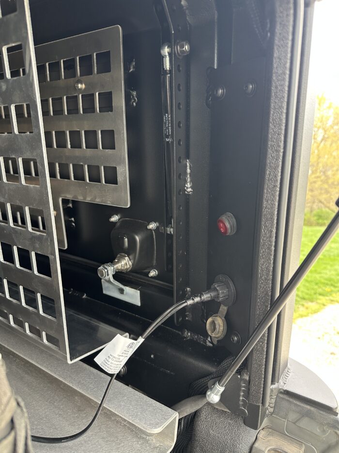 Switch and socket for ARB fridge freezer on interior panel of Nutshell XL canopy Nuthouse Industries